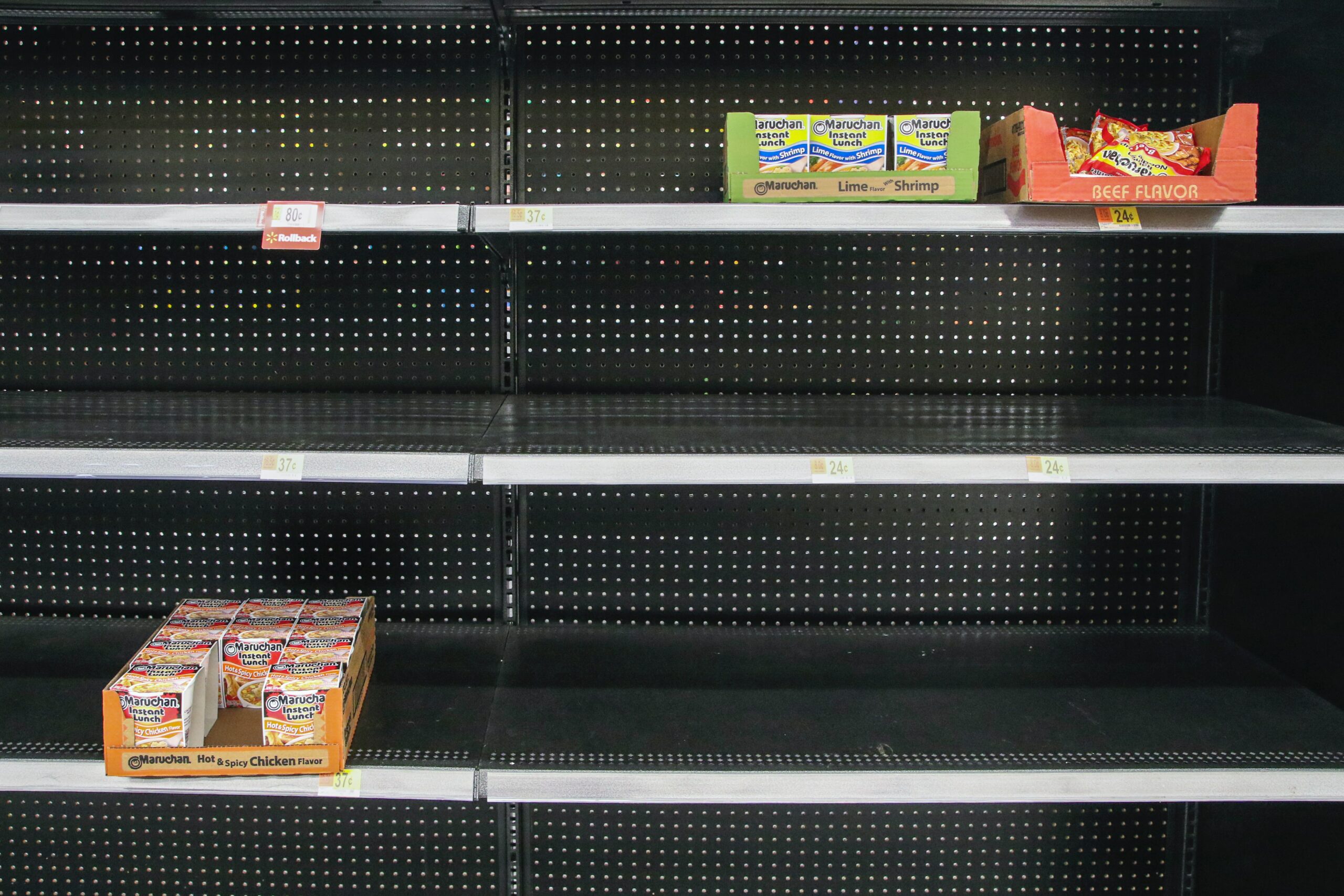 Empty shelves at Walmart with only three product displays remaining