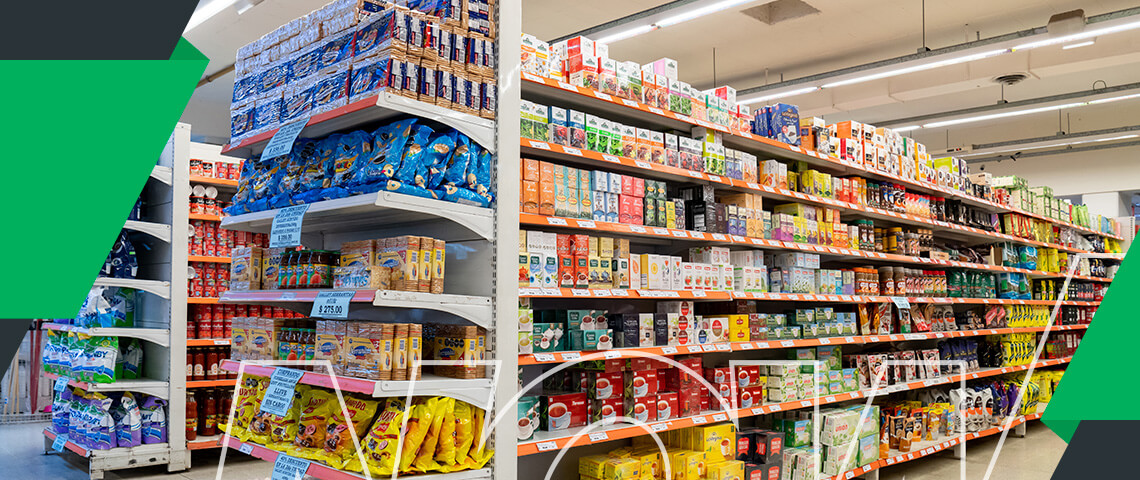 a grocery store aisle with a sign that says coca cola on it