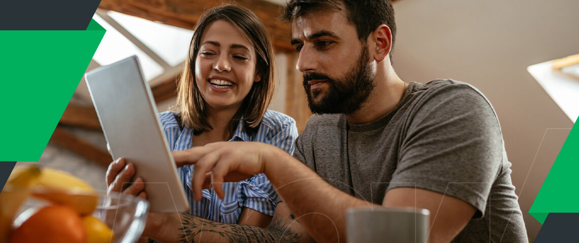 two people looking at an ipad